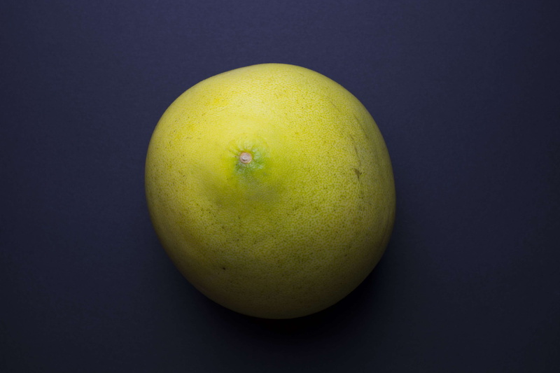 food, green color, food and drink, black background, colored background, indoors, fruit, single object, freshness, high angle view, pear, healthy eating