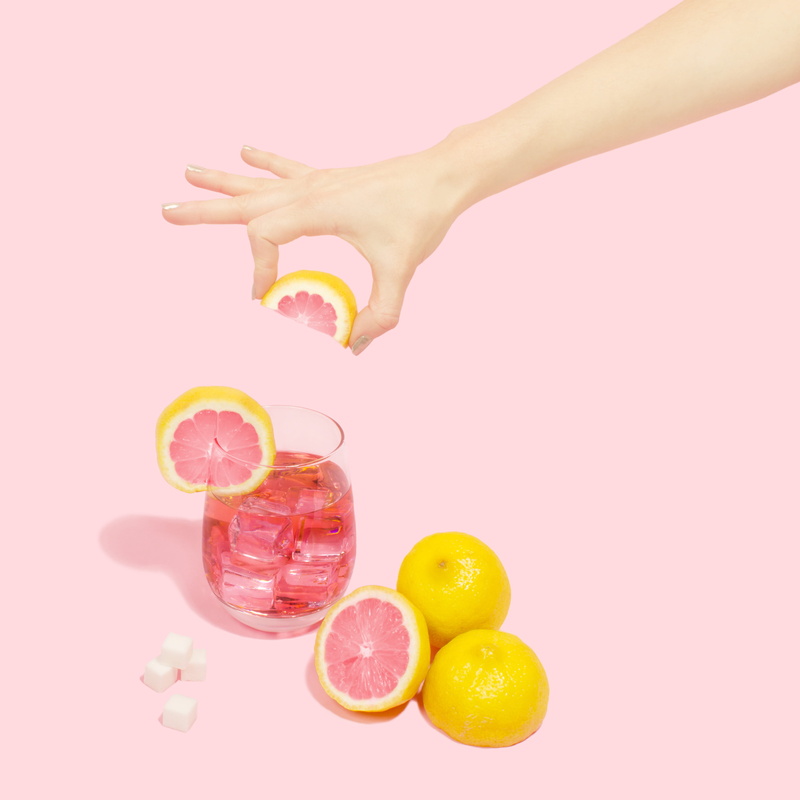 human, orange juice, sliced, peel, lime, human hand, pomelo, pink color, pink background, white background, human limb, orange color, colored background