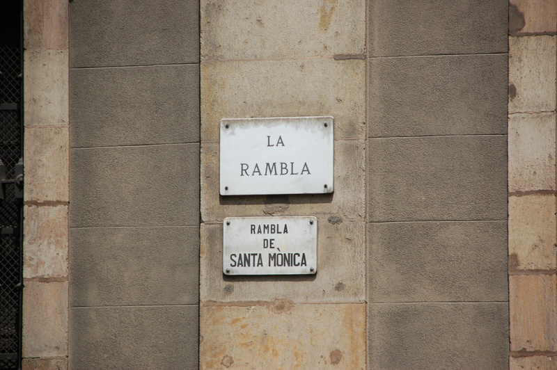 wall - building feature, pattern, 2K, outdoors, number, communication, non-western script, wall, information, La Rambla, Spain, text, rambla, la, arrow symbol