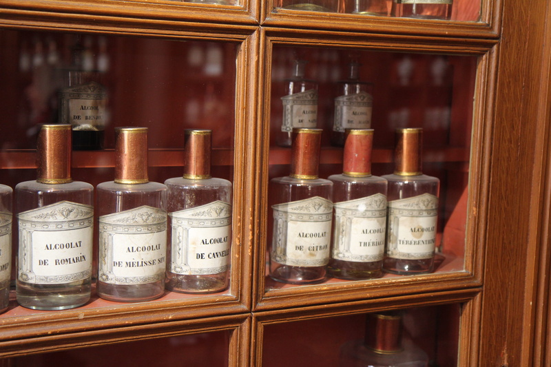 medicine cabinet, container, large group of objects, healthcare and medicine, indoors, medicine, food and drink, jar, alternative medicine, historical monument