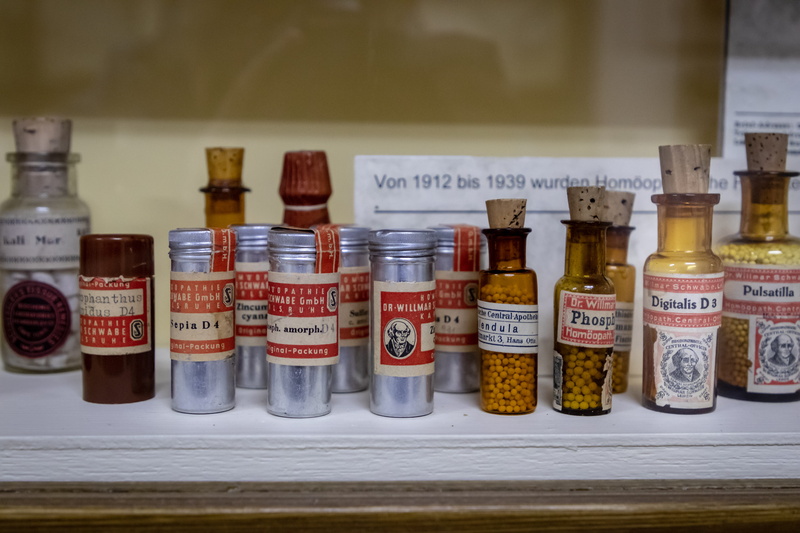 in a row, spice, beer, medication, homeopathic medicine, science, drink, jar, beverage, text, indoors, tin, bottle, cabinet, aluminium, no people, food