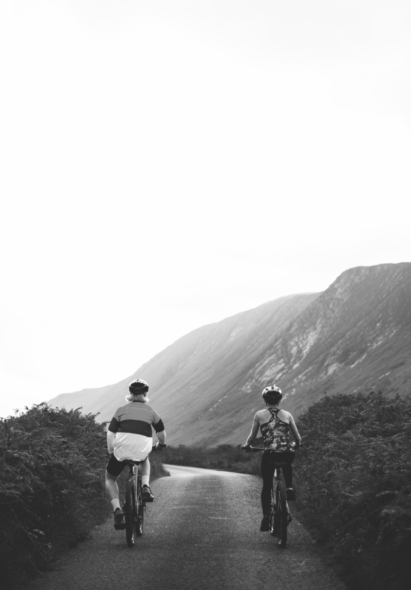 activity, active, monochrome, transportation, woman, route, lifestyles, mountain range, leisure activity, bicycles, people, road, real people, roadway