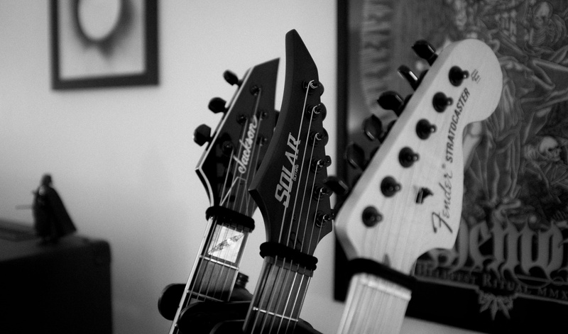 string instrument, silhouette, wood - material, domino, no people, sheet, wall - building feature, musical instrument string, bokeh, guitar, indoors, selective focus