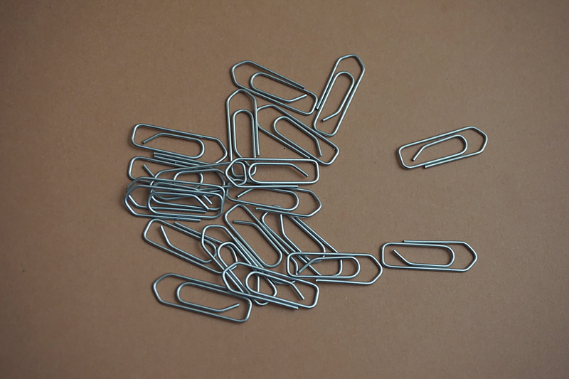 colored background, studio shot, connection, paper, office supply, variation, directly above, no people, paper clip, business, steel, indoors, high angle view