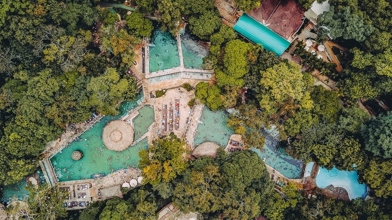 city, built structure, building, view, green color, fish, animal, amphiprion, resort, water, plant, waterfront, scenery, high angle view, town, tree, aerial view