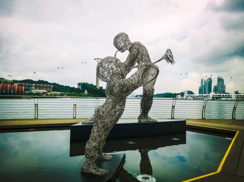 nature, metal, outdoors, silver, saxophone, aluminium, cloud - sky, wire sculpture, steely, statue, man, music, built structure, abstract, city, railing