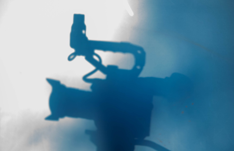 los angeles, film, standing, outdoors, video camera, equipment, male likeness, cinema, human representation, focus on shadow, sunlight, gear, representation