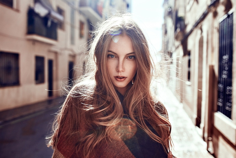 architecture, looking at viewer, city, blue eyes, wavy hair, teenager, headshot, women, young women, blonde, hairstyle, blond hair, face, day, beauty, one person