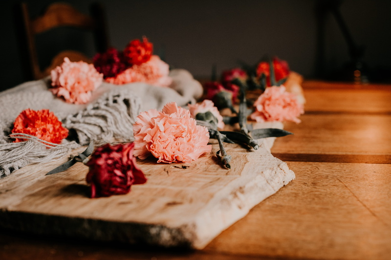 food and drink, freshness, blur, celebration, no people, wood, color, bloom, roses, fragrant, beautiful, ceremony, cutting board, flowers, romance, flower