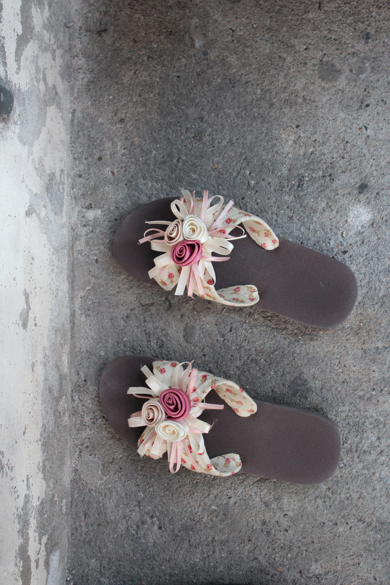 indoors, freshness, vulnerability, no people, high angle view, petal, slippers, still life, shoe, flowering plant, fragility, mountain pine, shoes, beauty in nature