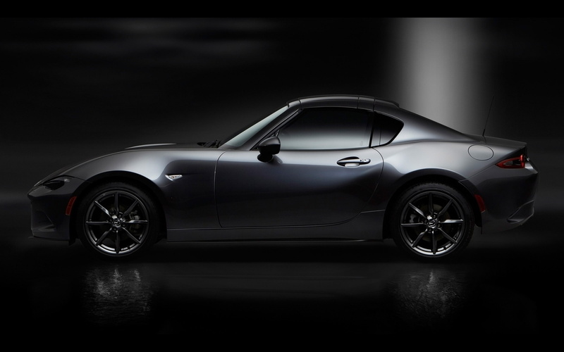 profile view, stationary, auto, studio shot, mode of transportation, poster, mx, retro styled, indoors, side view, motor vehicle, black color
