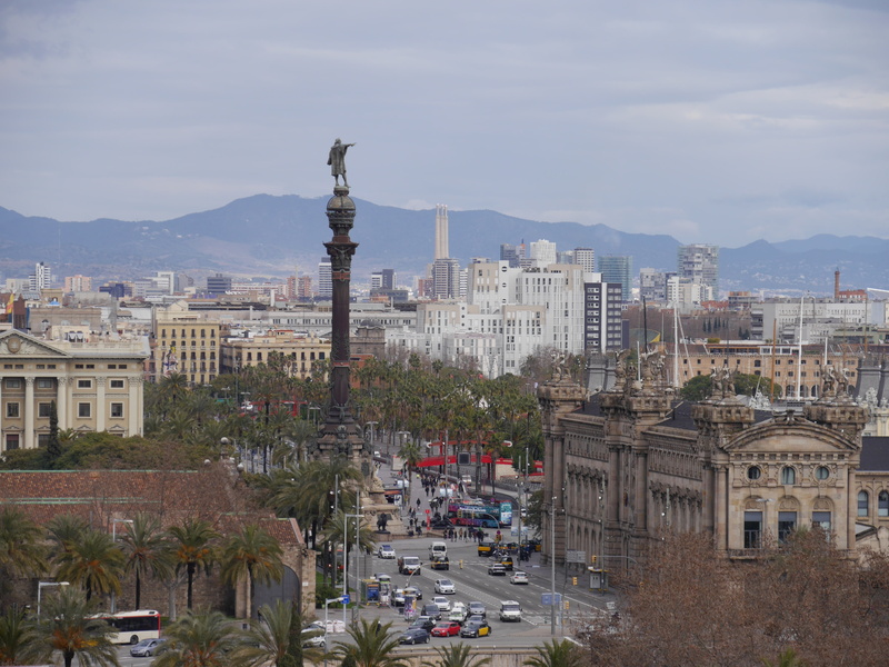 mountain, cloudy, nature, blue, car, building exterior, architecture, beside, city attraction, barcelona, buildings, motor vehicle, colon, day, city view