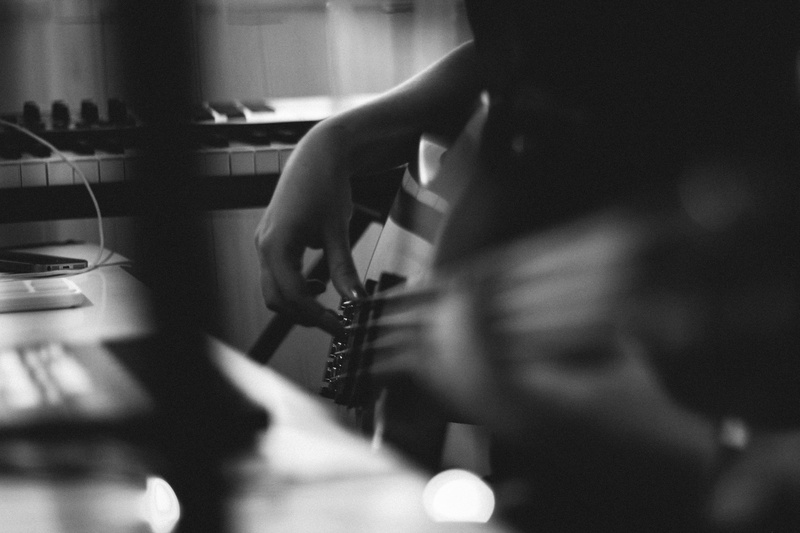 bw, business person, synthesizer, selective focus, sitting, furniture, connection, music, one person, working, desk, strings, adult, sound, guitar, wireless technology