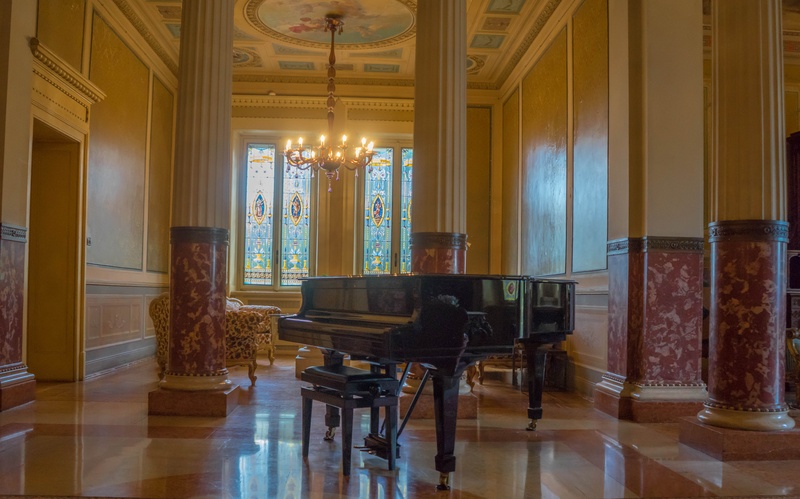 lighting equipment, musical equipment, hall, gray, floral, fabric, piano, vintage, black, ornate, window, flooring, hardwood floor, floral design, built structure