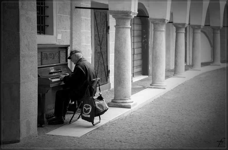 city, man, leisure activity, transportation, day, playing, sitting, corridor, full length, black white, 2K, one person, lifestyles, built structure, building