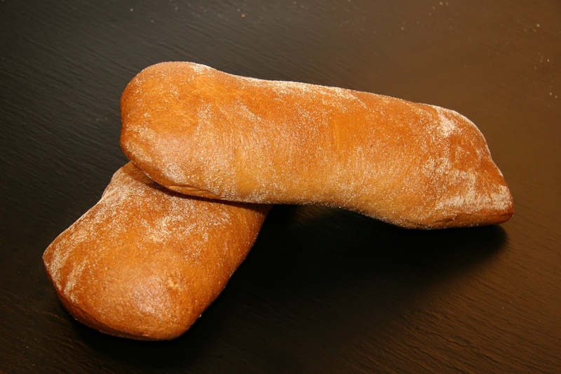 still life, indulgence, table, dining, food and drink, baker, bakes bread, wellbeing, freshly baked, ciabatta, serving size, high angle view, recipe, temptation