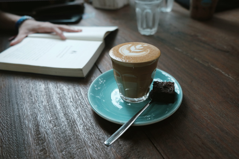 brownie, espresso, ceramic container, latte, cup, focus on foreground, book, 2K, refreshment, food and drink, reading book, background, dark tone
