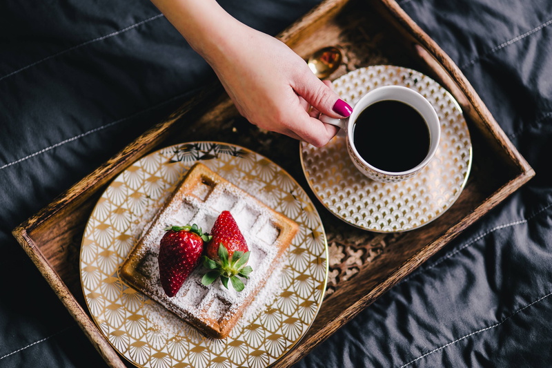 adult, waffle, hand, healthy eating, cup, preparation, high angle view, one person, food, bed, sweet food, coffee, tray, wooden tray, midsection, berry fruit