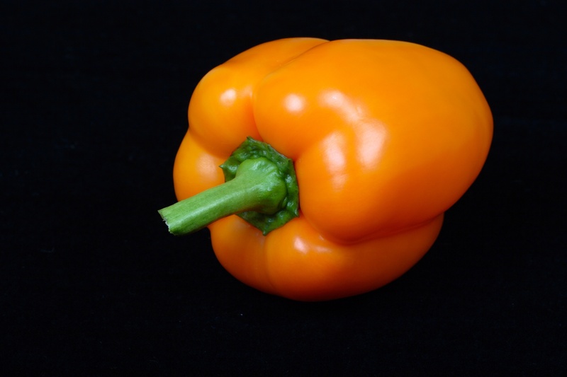 black background, freshness, plant stem, orange color, red bell pepper, yellow, food, still life, healthy eating, indoors, red, green color, close-up, studio shot