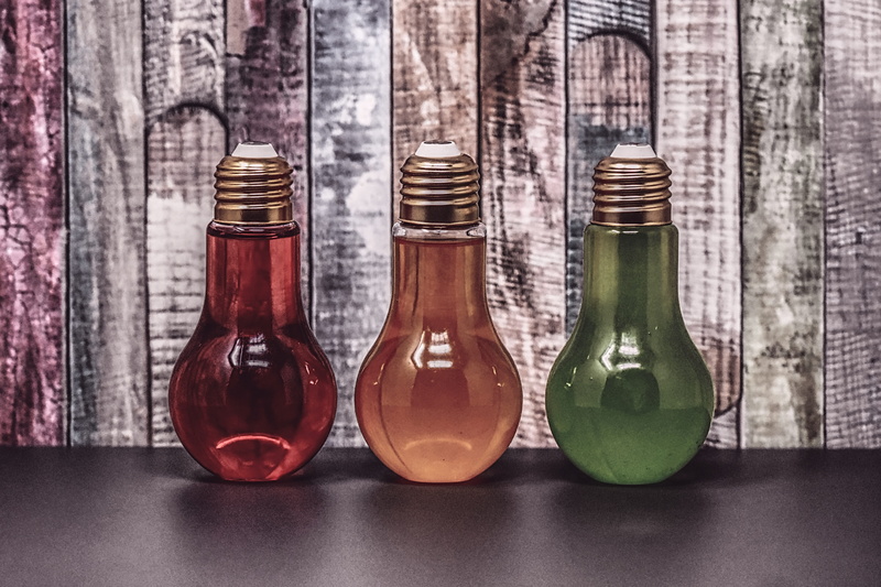 bottles, glass - material, still life, bottle, reflection, variation, food and drink, side by side, indoors, no people, beverages, arrangement, light bulbs