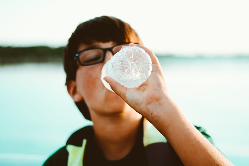bottle, lifestyle, land, liquid, childhood, sunlight, sky, drinking, adult, day, focus on foreground, man, boy, 5K, holding, young adult, one person, drink