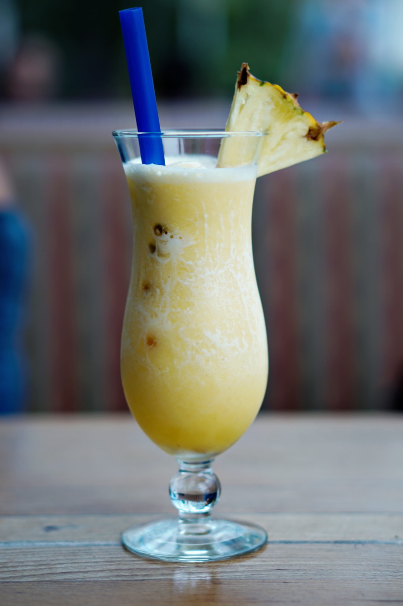 drinking glass, orange, refreshment, fruit, wellbeing, food and drink, indoors, juice, straw, household equipment, table, glass, freshness, no people, fruit juice