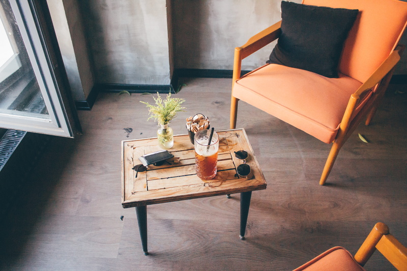 absence, sofa, tea, no people, window, wood - material, plant, coffee, furniture, indoors, orange color, table, contemporary, interior design, chairs, flower