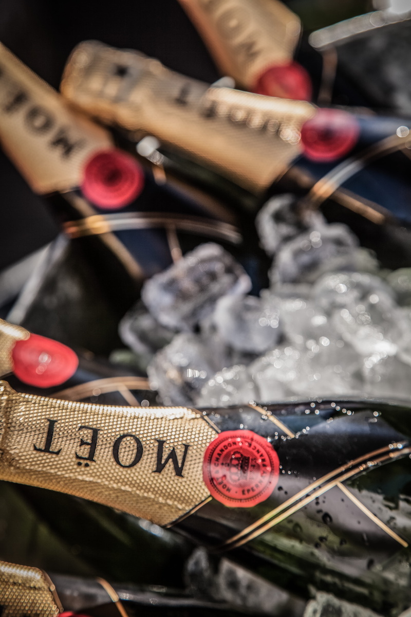 green bottle, focus on foreground, text, celebrate, label, gold foil, Moet Champagne, wood - material, champagne, Bottles, ice bucket, bucket, garden party