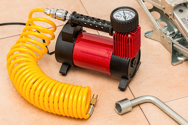 device, metal, inflate, close-up, flat tyre, compression, no people, air, occupation, power supply, communication, technology, compressor, automotive, red