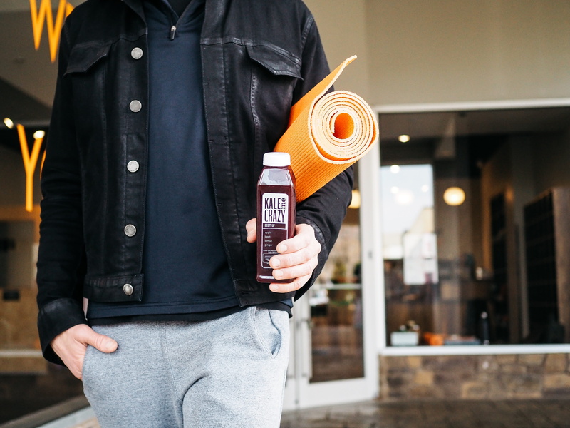 day, book, city, men, healthy, leather, man, denim jacket, focus on foreground, casual clothing, person, building exterior, holding, male, joggers, kale