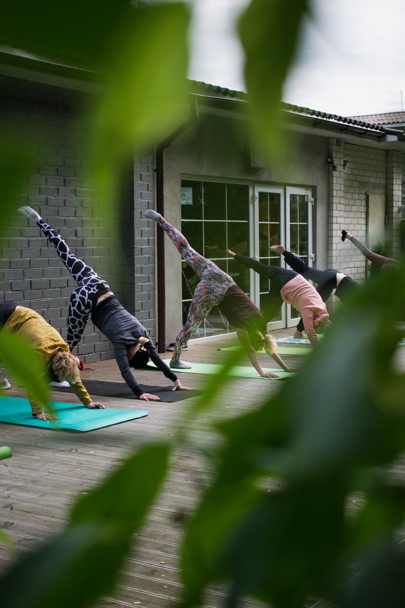 exercise, yoga, sport time, outdoors, day, life, class, pose, nature, building exterior, men, person, selective focus, building, people, blur, plant, lifestyle