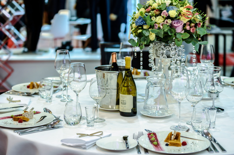 setting, food, tableware, dining, plate, flower, bouquet, container, vase, 5K, table napkins, white, wine glasses, round, bottle, focus on foreground