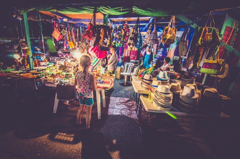 multi colored, night, nightlife, hat, kid, casual clothing, illuminated, kids, large group of objects, vendor, market, adult, girls, real people, arts culture and entertainment
