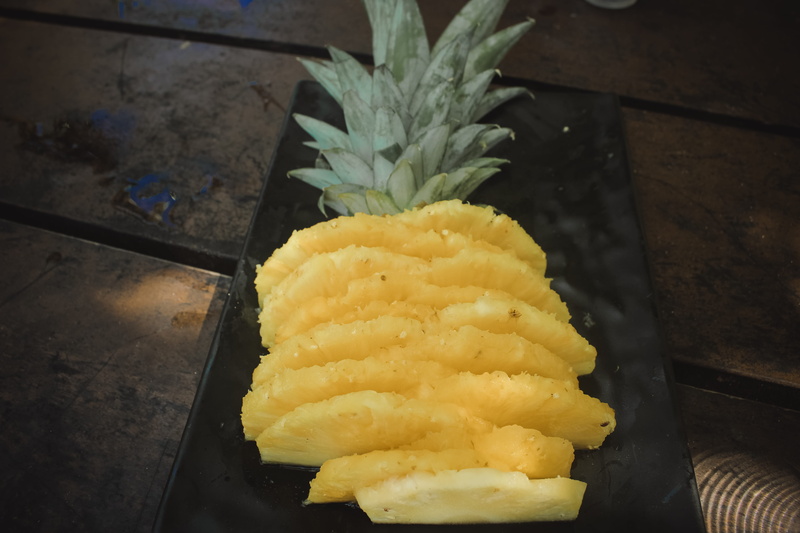 pineapple, tropical fruit, indoors, creme, snack, high angle view, table, floor, nature, arachnid, food and drink, freshness, wood - material, fruit, quince