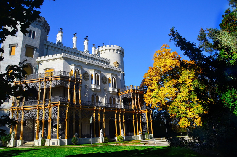 hluboka nad vltavou, building, building exterior, autumn, travel destinations, sunlight, religion, low angle view, outdoors, castle, day, plant, nature
