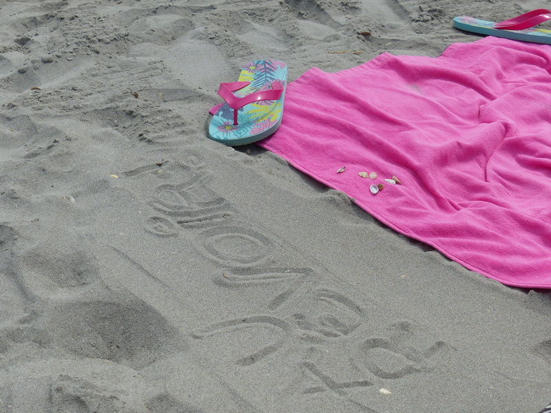 creativity, word, writing, idleness, absence, beach, outdoors, towel, shell, high angle view, sandal, summer, tong, goodbye, shoe, flip-flop, water, footprint