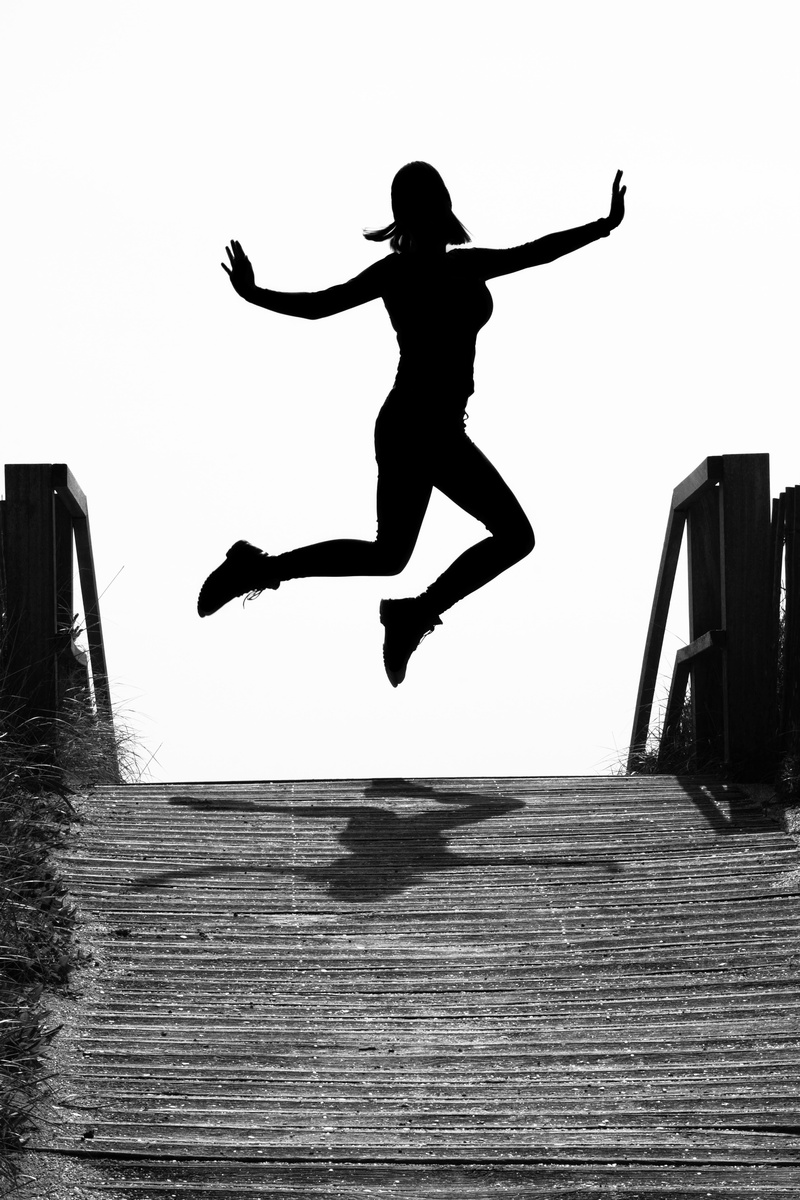 silhouette, sea, outdoors, built structure, joy, clear sky, human arm, young woman, female, motion, jumping, girl, shadow, slightly, vitality, in the air