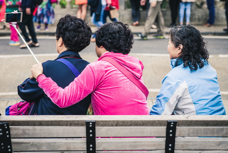 real people, adult, lady, 4K, park bench, street, smiling, men, women, wooden, day, sit, phone, sitting, friend, hairstyle, person, friendship, seat, photography