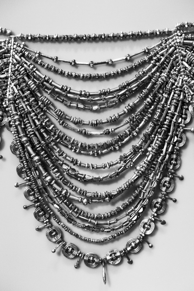no people, decoration, black and white, Necklace, flower, golden, ornament, black, age, stack, large group of objects, metal, still life, bronze, design