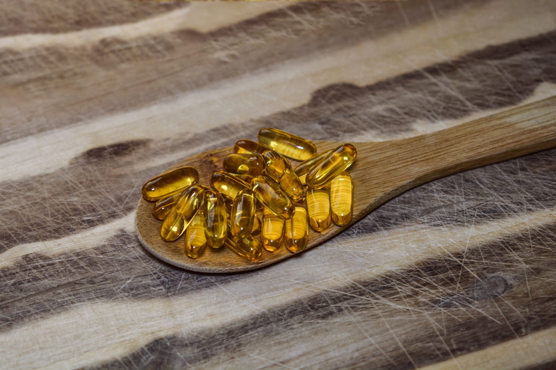 close-up, yellow, high angle view, focus on foreground, two objects, gel, pharmaceutical, 3, 4K, dose, jewelry, drug, table, oil, fish, capsules, jell