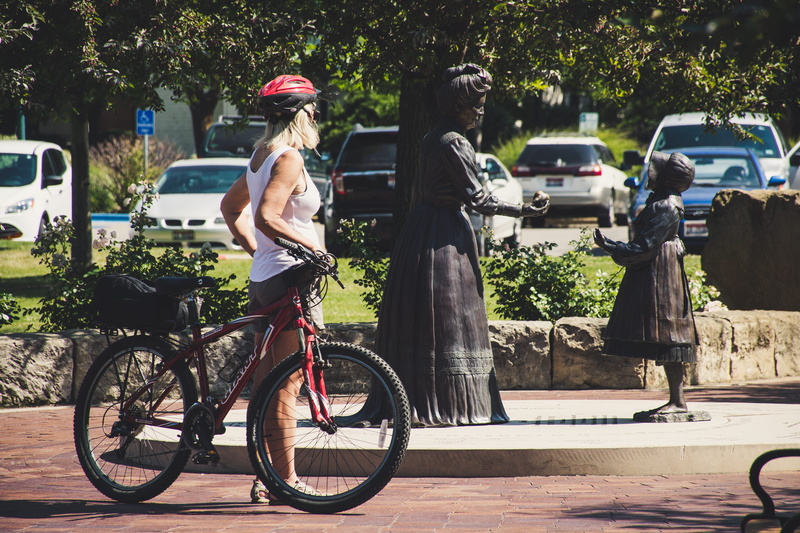 helmet, day, rear view, 5K, white, transportation, people, two people, biker, car, bicycle, road, statues, holding, wearing, city, street, casual clothing