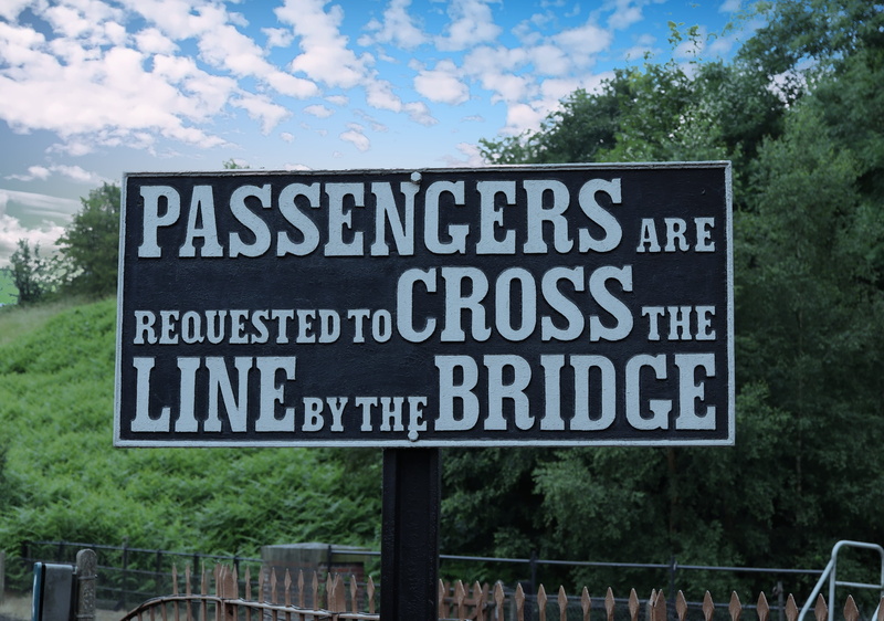 information, script, plant, non-western script, western script, platform, outdoors, train, sky, warning, road sign, railway, cloud - sky, day, message