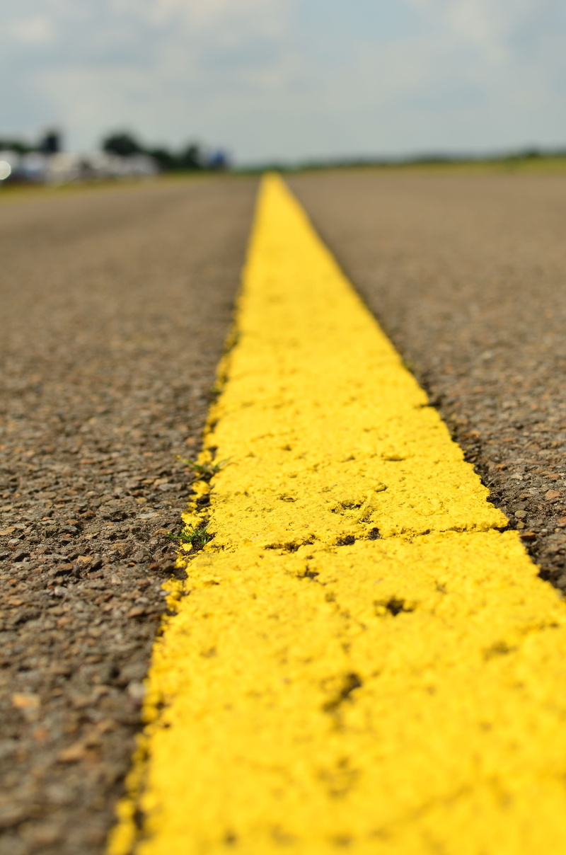 sign, direction, the way forward, asphalt, no people, transportation, road marking, close-up, symbol, double yellow line, day, roadway, city, selective focus