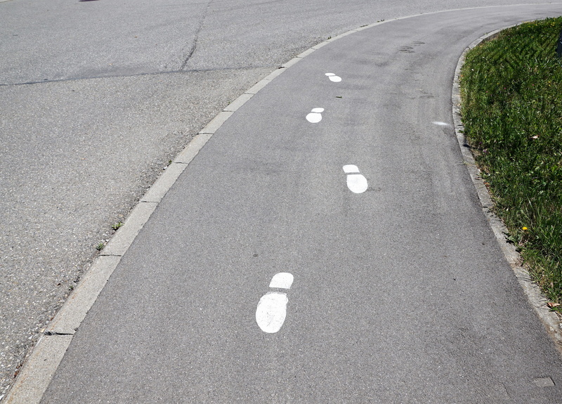 gray, direction, traffic, field, marking, grass, city, land, no people, highway, drive, sign, road, symbol, street, day, curve, travel, concrete, asphalt