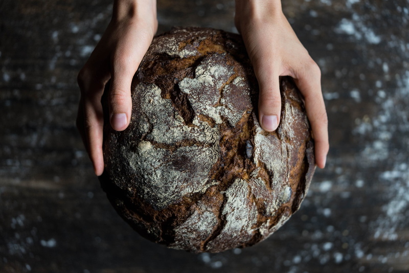 bread, solid, 4K, indoors, human hand, baker, human, wood, food, flour, focus on foreground, baked, textured, dark, hands, human body part, hand, fruit