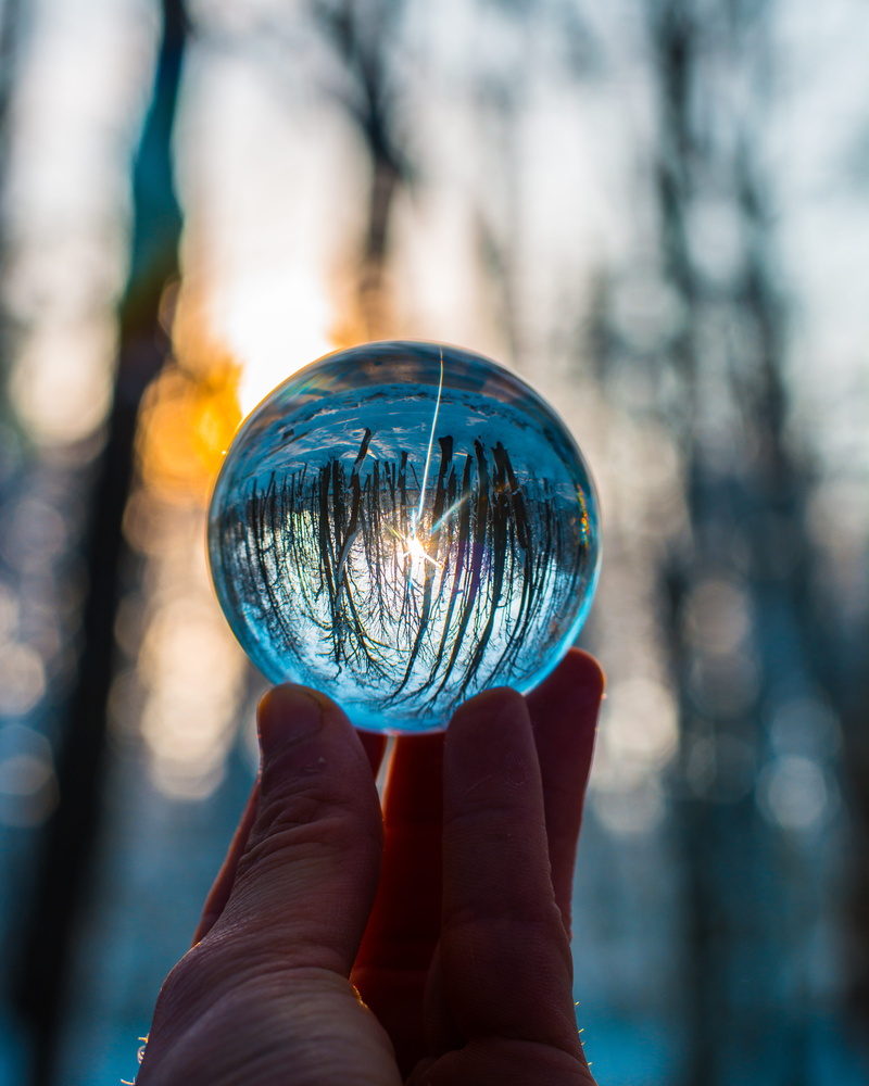 ball, transparent, human limb, focus, glass - material, crystal, close-up, real people, blur, holding, reflection, human hand, outdoors, human finger