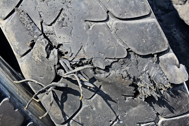 tyre stack, environment, weathered, Auto, day, damaged, close-up, wheel, outdoors, pattern, built structure, mature disposal, Rubber, stacked, architecture