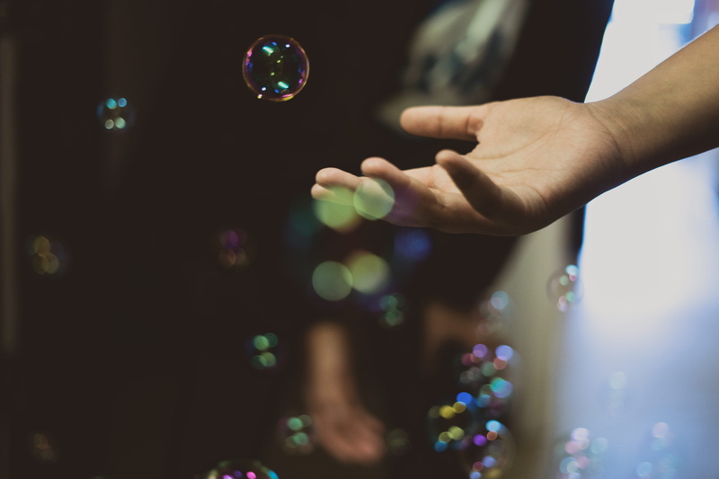 bubbles, one person, child, body part, hand, accessories, holding, nature, mid-air, human body part, drink, accessory, indoors, person, brown, sphere, human hand