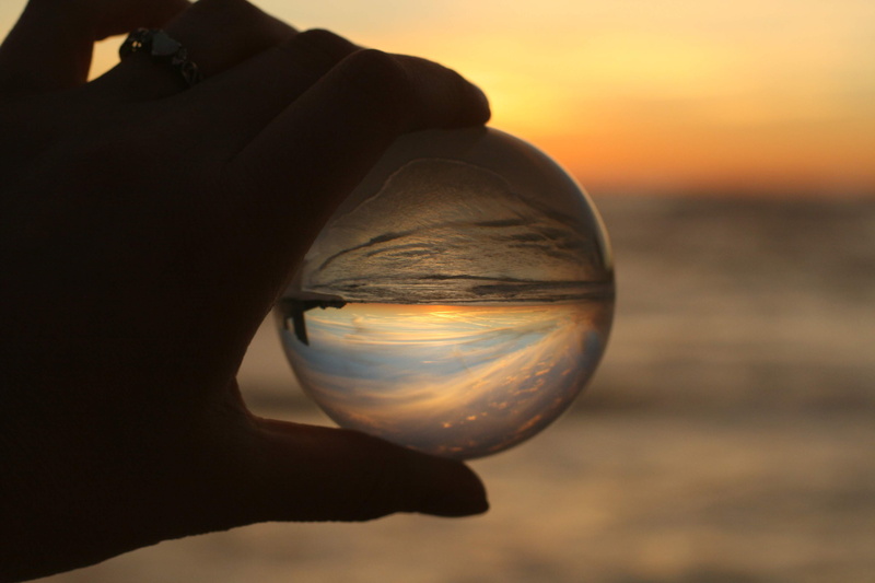 4K, glass, sky, finger, focus on foreground, holding, universe, close-up, sphere, hand, goblet, scenics - nature, one person, person, sun, reflection