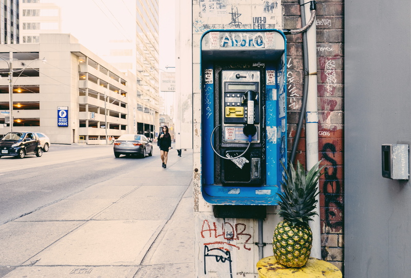 person, plant, architecture, urban, 5K, vehicle, parking, food, pineapple, incidental people, pay phone, human, city, car, motor vehicle, machine, built structure